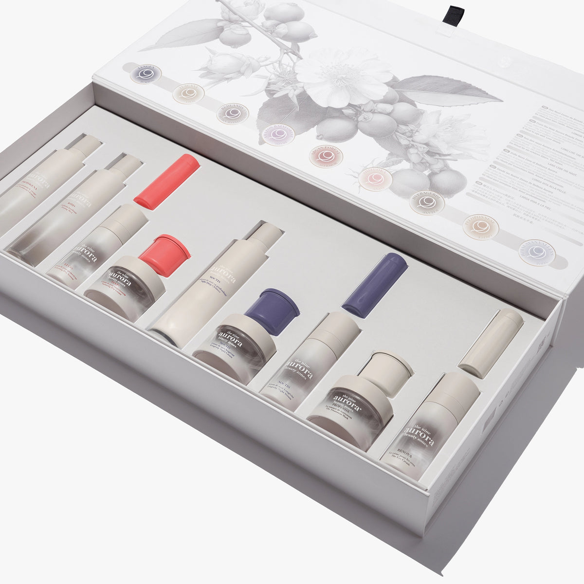 The Nine Aurora skincare set — open packaging box group shot, original photoshoot