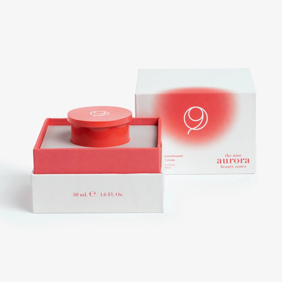 The Nine Aurora Lucis Nurturing Day Cream refill pod — open packaging box, original photoshoot