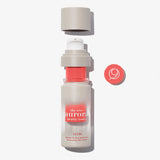 The Nine Aurora Lucis Protecting Day Serum — open bottle product shot, original photoshoot