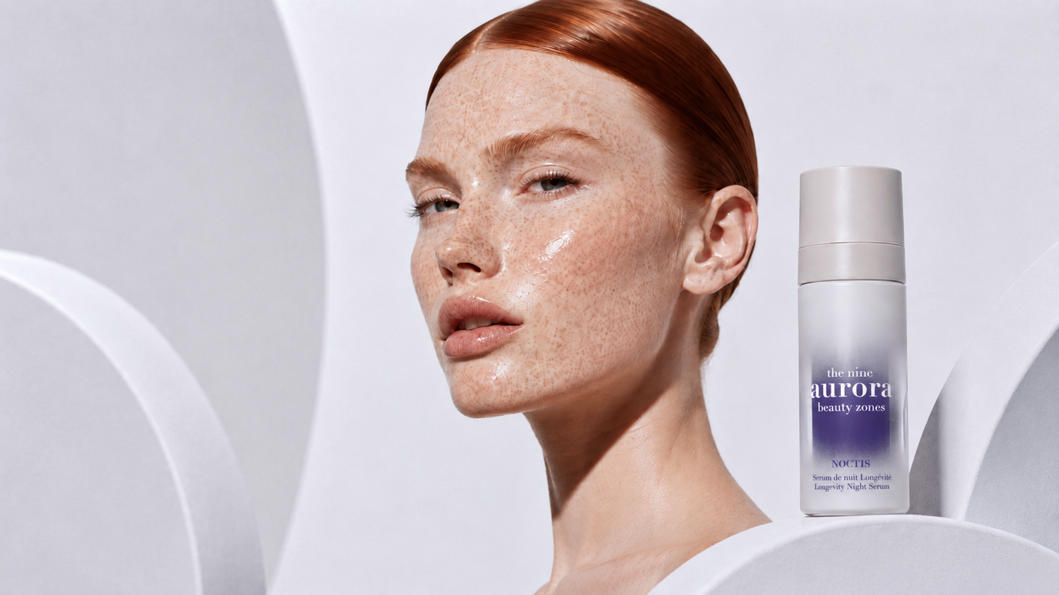 Noctis Longevity Night Serum beside a freckled model in a luminous luxury skincare portrait for The Nine Aurora.